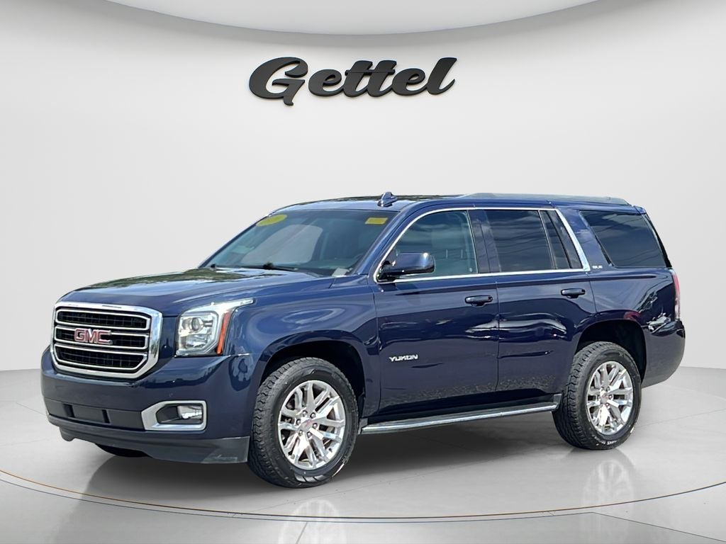 2020 GMC Yukon SLE in Dark Sapphire Blue Metallic — front three-quarter view