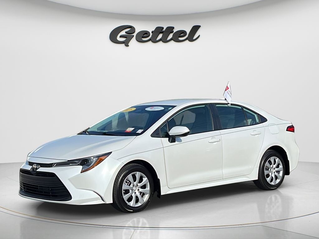 2026 Toyota Corolla LE in Wind Chill Pearl* — front three-quarter view