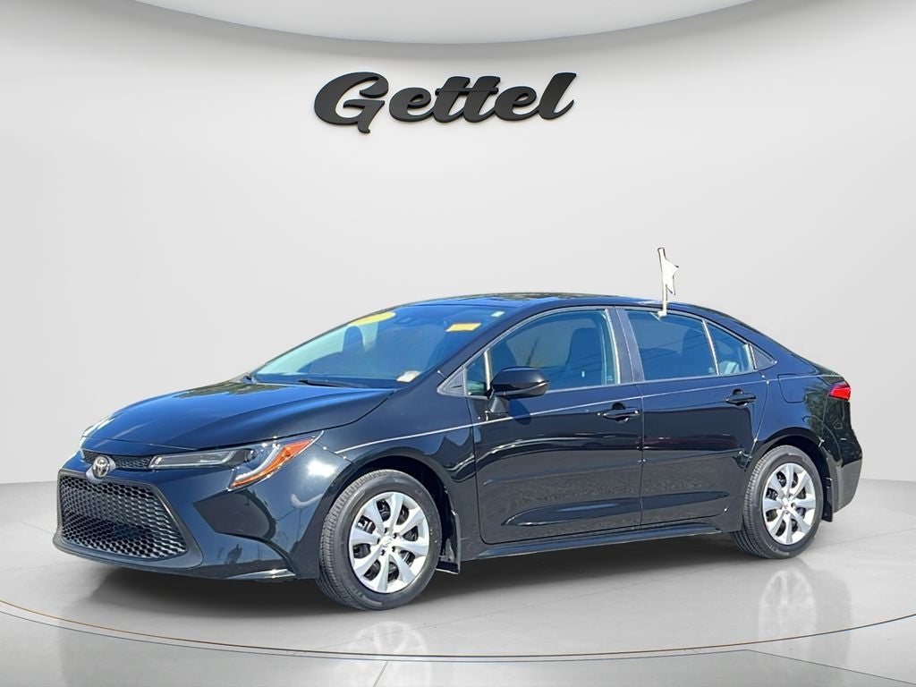 2022 Toyota Corolla LE in Black Sand Pearl — front three-quarter view