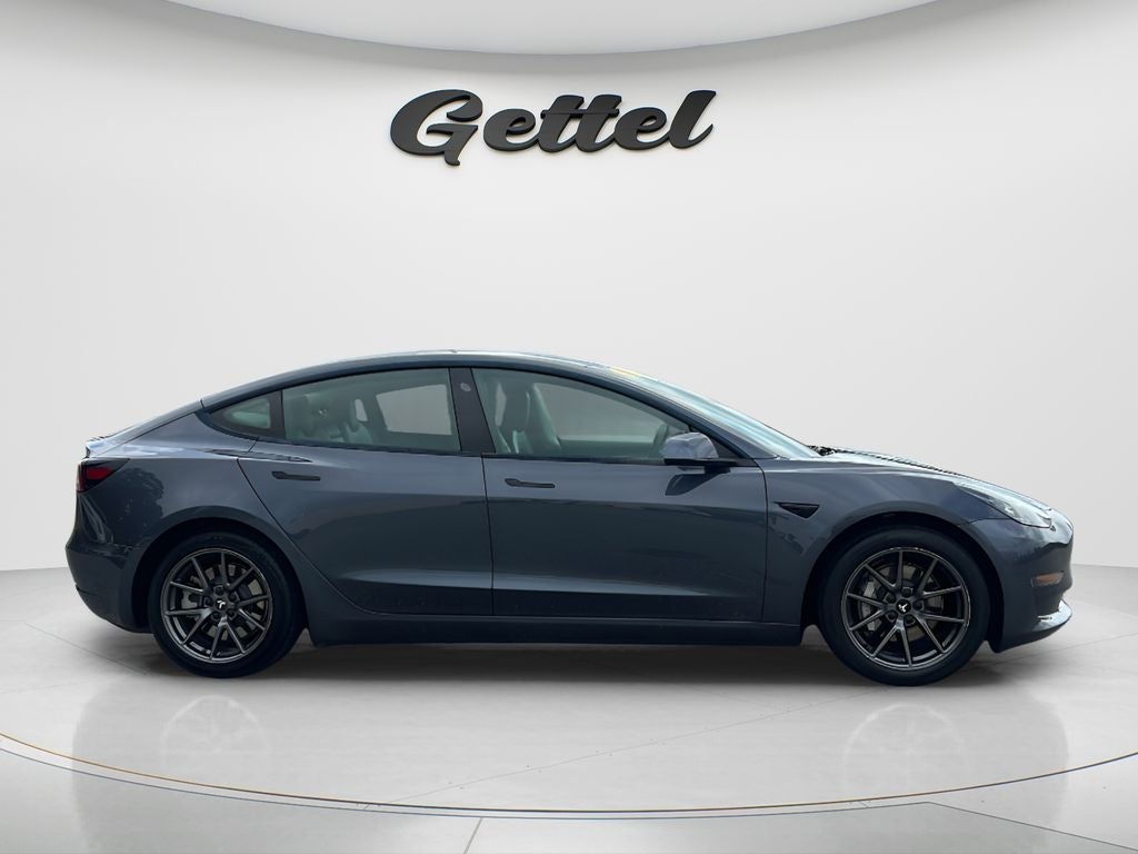 2021 Tesla Model 3 — rear three-quarter view