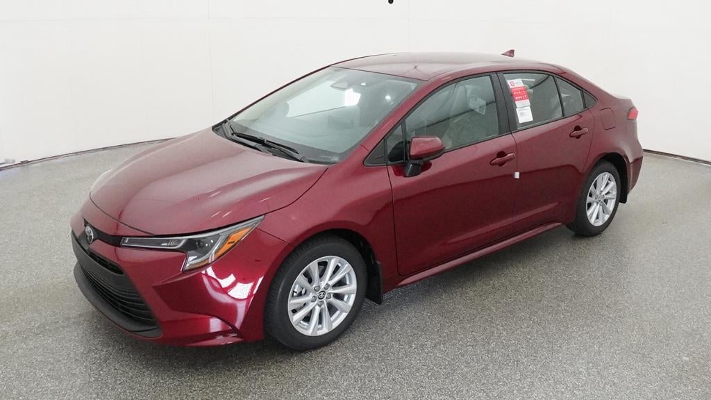 2026 Toyota Corolla LE in Ruby Flare Pearl <a role='button' class='viewDgDisclaimersButton' data-toggle='modal'...